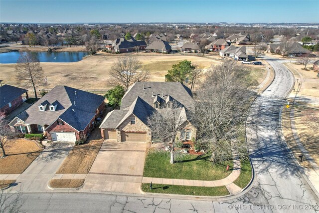 aerial view with a residential view and a water view