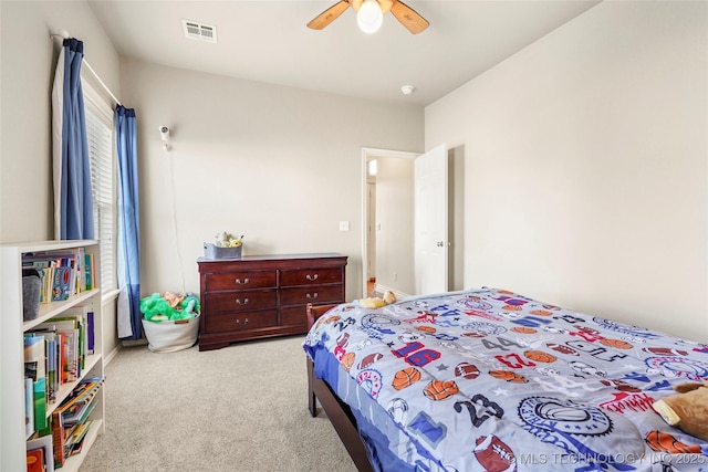 bedroom with visible vents, carpet floors, and ceiling fan