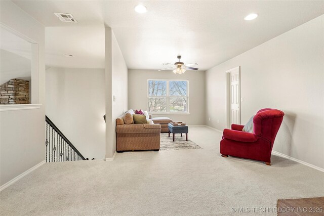 living room featuring a ceiling fan, carpet, visible vents, baseboards, and recessed lighting