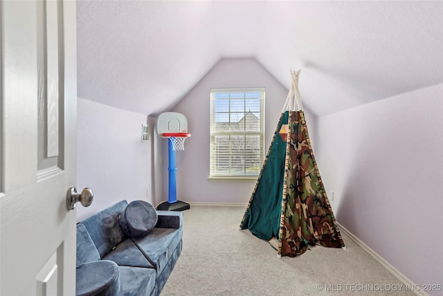 game room featuring lofted ceiling, carpet, baseboards, and a textured ceiling