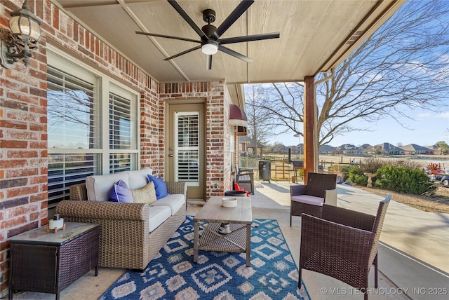 view of patio with outdoor lounge area and ceiling fan