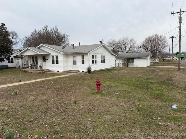 ranch-style home with crawl space, a yard, and a porch