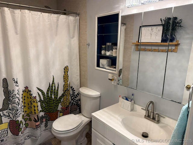 full bathroom with curtained shower, toilet, and vanity