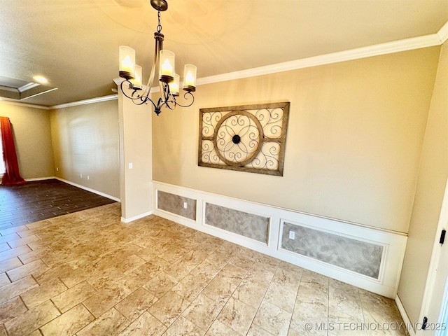 unfurnished dining area with a chandelier, baseboards, and ornamental molding