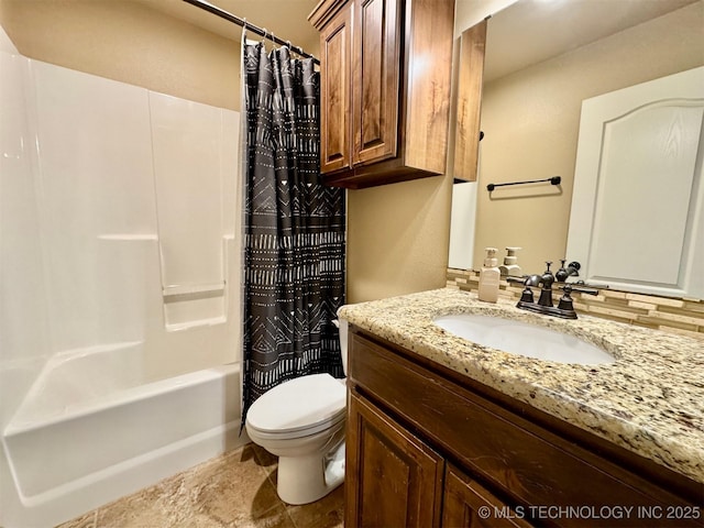 bathroom featuring toilet, shower / bath combo, and vanity