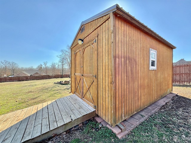 view of shed with fence