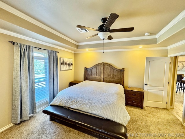 bedroom featuring a raised ceiling, ornamental molding, visible vents, and light carpet