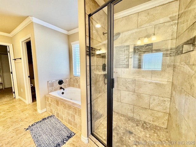 bathroom featuring crown molding, a garden tub, baseboards, and a stall shower