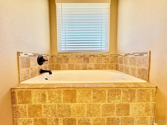 bathroom with a garden tub