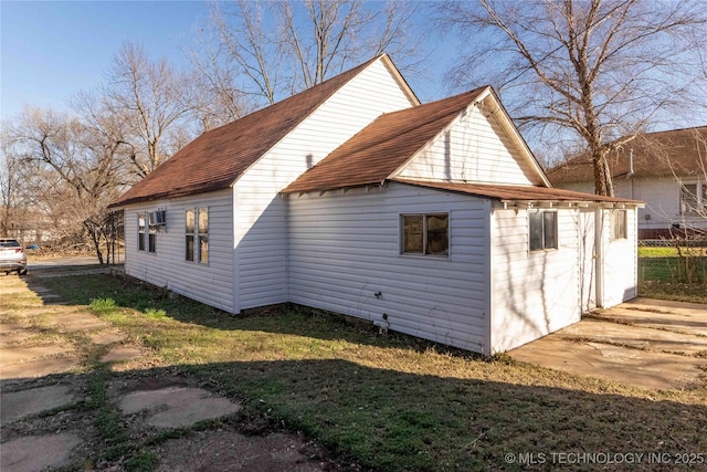 view of property exterior with a lawn