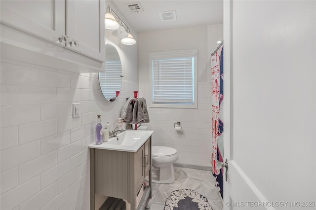 full bathroom with tile patterned floors, visible vents, toilet, and vanity