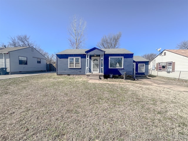 bungalow featuring a front yard, fence, and crawl space