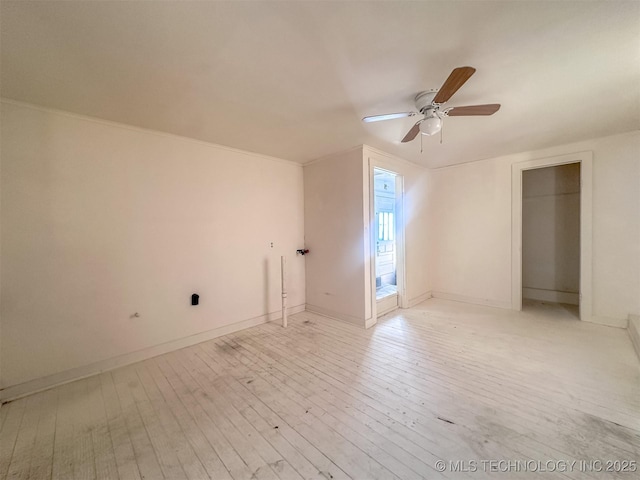 bonus room featuring light wood finished floors, ceiling fan, and baseboards