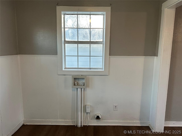 laundry room with dark wood finished floors, a wainscoted wall, hookup for a washing machine, and laundry area