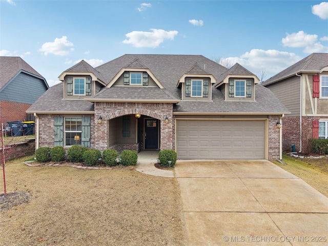 view of front of property with brick siding, driveway, a shingled roof, and a garage