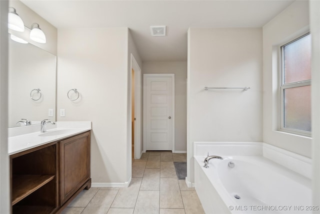 full bath with tile patterned floors, visible vents, baseboards, a bath, and vanity