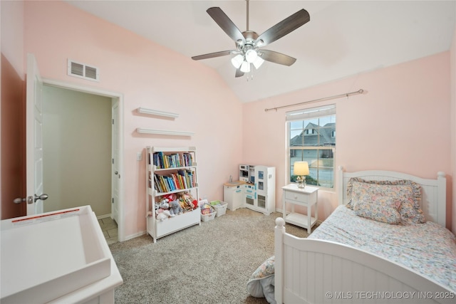 carpeted bedroom featuring visible vents, a ceiling fan, and vaulted ceiling