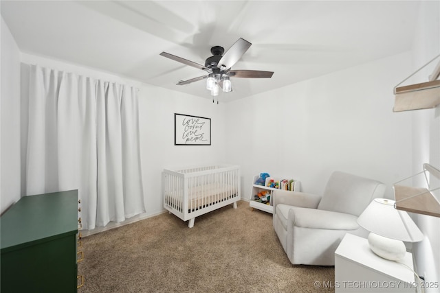 bedroom featuring ceiling fan, carpet, and a nursery area