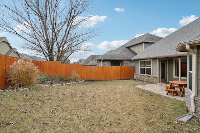 view of yard featuring a patio and a fenced backyard