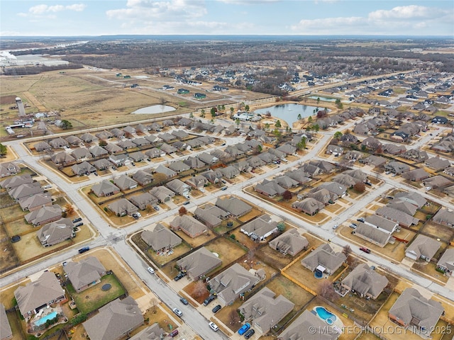 aerial view with a residential view and a water view