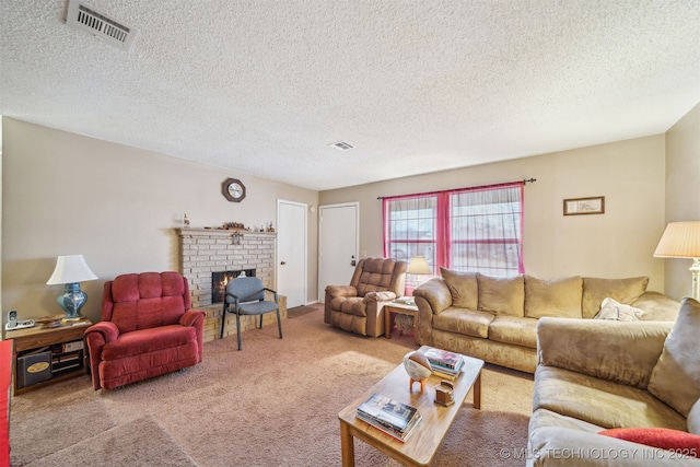 carpeted living area with visible vents, a textured ceiling, and a fireplace