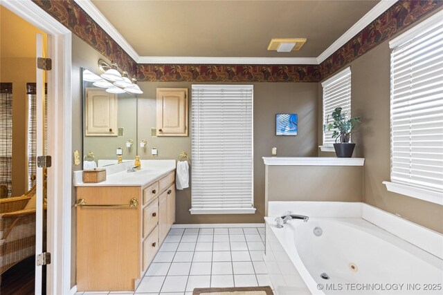 bathroom with tile patterned floors, a whirlpool tub, vanity, and ornamental molding