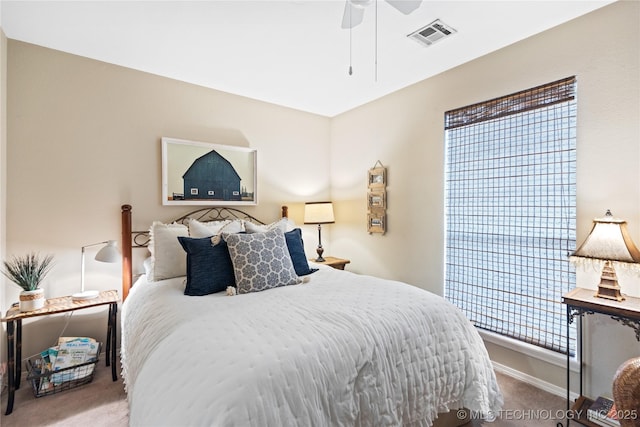 bedroom featuring carpet flooring, a ceiling fan, visible vents, and baseboards