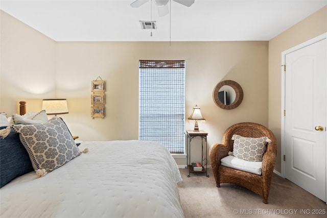 bedroom featuring carpet flooring, a ceiling fan, visible vents, and baseboards