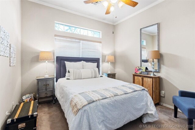 carpeted bedroom with ceiling fan, baseboards, and ornamental molding