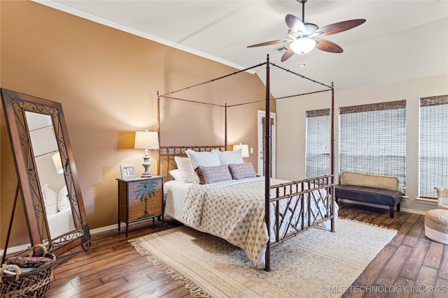 bedroom featuring crown molding, ceiling fan, baseboards, vaulted ceiling, and hardwood / wood-style floors