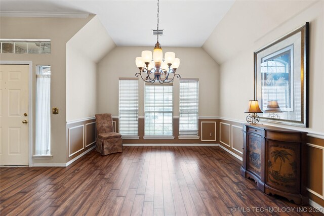 interior space with visible vents, a wainscoted wall, dark wood-style floors, an inviting chandelier, and vaulted ceiling