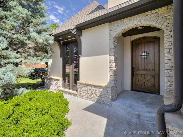 12491 S 105th Ave E, Bixby, OK 74008 - entrance to property featuring stone siding, stucco siding, and a shingled roof