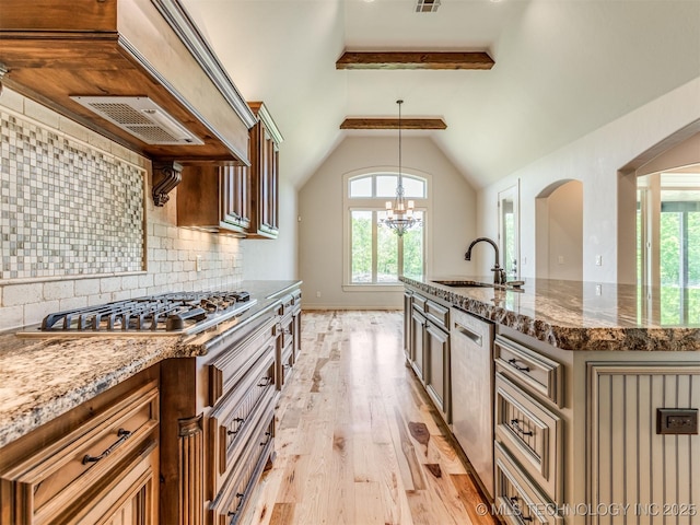 12491 S 105th Ave E, Bixby, OK 74008 - kitchen featuring a sink, plenty of natural light, light wood finished floors, and appliances with stainless steel finishes