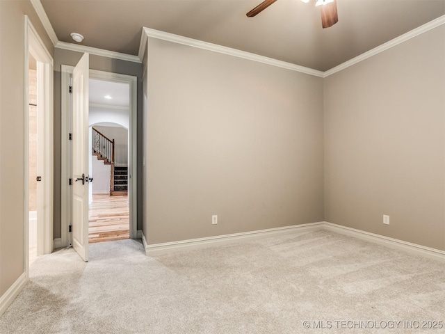 12491 S 105th Ave E, Bixby, OK 74008 - unfurnished room with ceiling fan, carpet flooring, arched walkways, ornamental molding, and baseboards