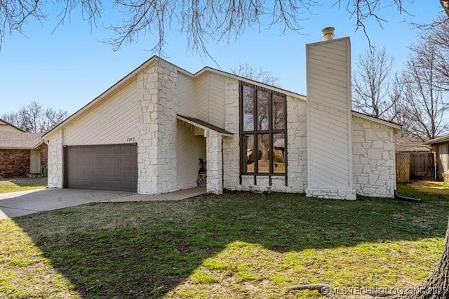 view of side of property featuring fence, concrete driveway, a chimney, a garage, and a yard