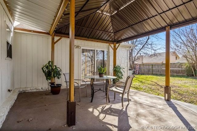 view of patio / terrace with outdoor dining space and fence