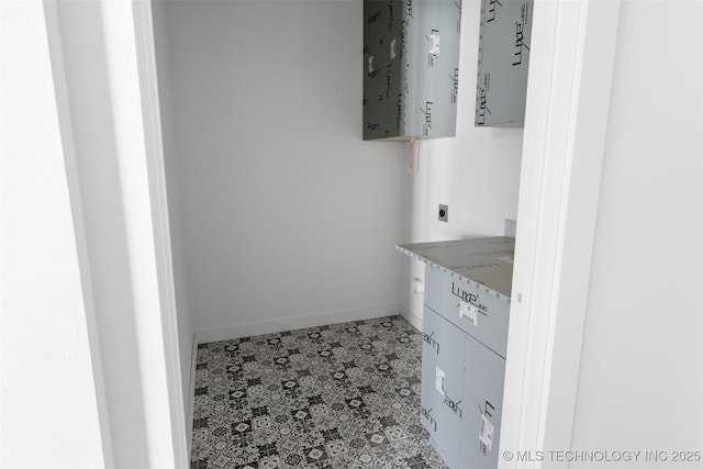 bathroom with vanity and baseboards