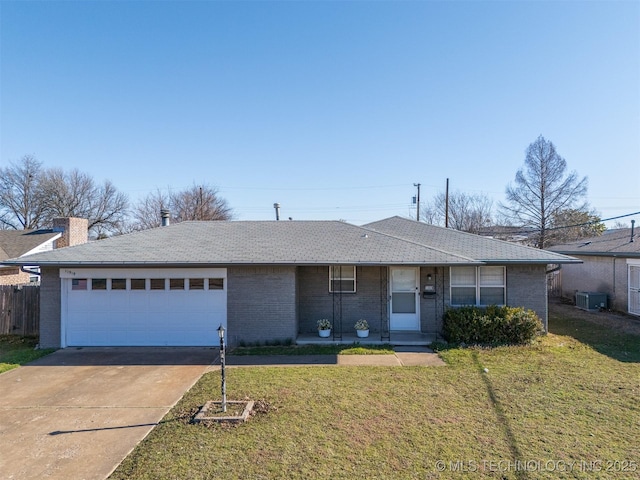 ranch-style house featuring a front yard, brick siding, a garage, and driveway