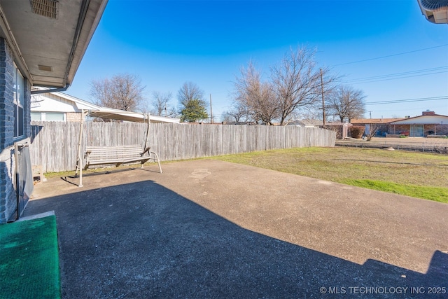 view of yard with a patio area and fence