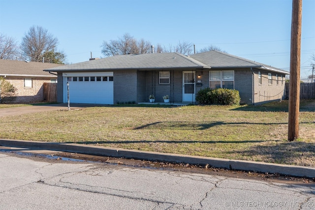 ranch-style home featuring fence, concrete driveway, a front lawn, a garage, and brick siding