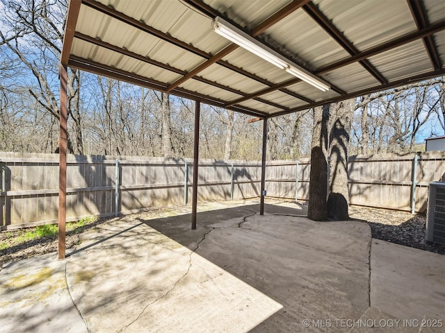 view of patio / terrace featuring central air condition unit and a fenced backyard