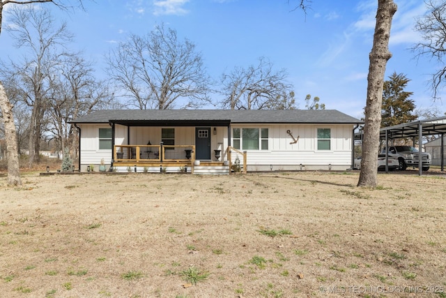 view of front of property featuring a carport, a porch, and board and batten siding