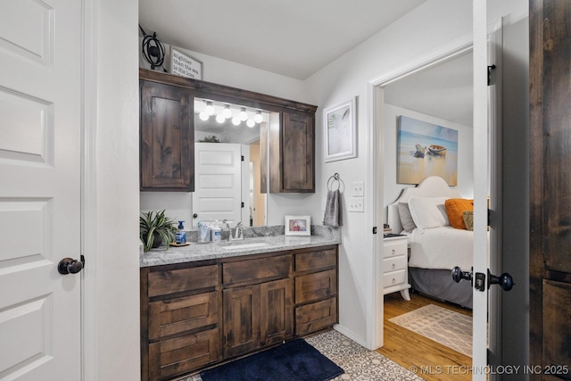 bathroom with ensuite bath and vanity