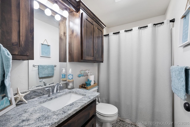 full bath with a shower with shower curtain, toilet, and vanity