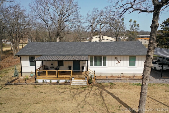 view of front of house featuring a front yard, roof with shingles, and crawl space