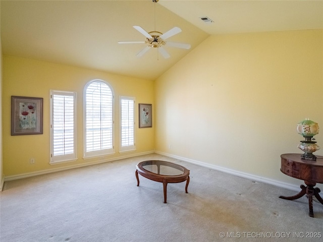 sitting room with baseboards, visible vents, carpet floors, and lofted ceiling