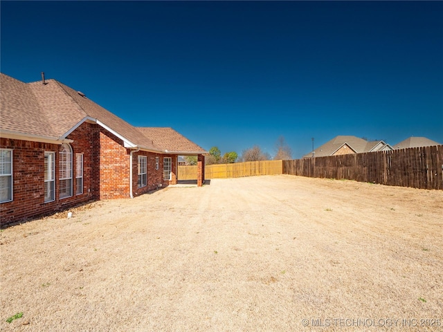 view of yard featuring a fenced backyard