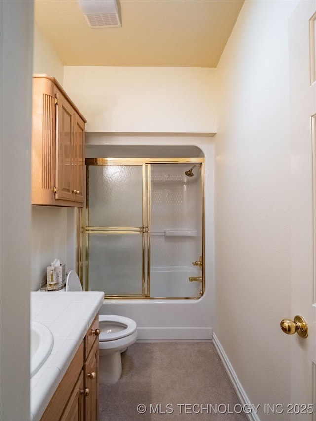 bathroom with visible vents, baseboards, toilet, combined bath / shower with glass door, and vanity