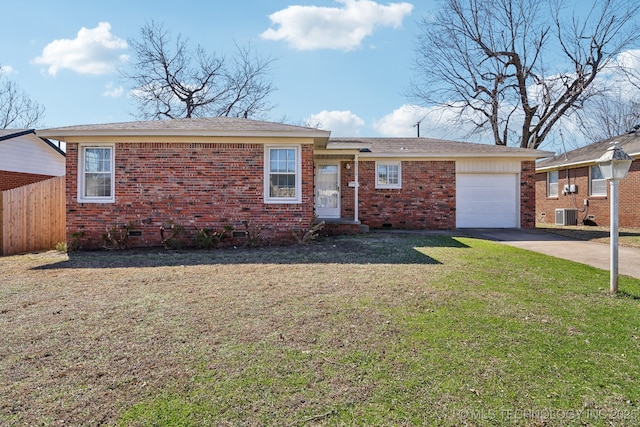 ranch-style home featuring driveway, central AC, a front lawn, crawl space, and brick siding