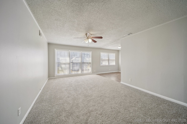 8930 E Marshall St, Tulsa, OK 74115 - unfurnished room with a ceiling fan, visible vents, carpet, baseboards, and a textured ceiling